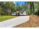 Inviting home featuring lush landscaping and a freshly paved driveway at 2798 Hutchins Rd, Lawrenceville, GA 30044
