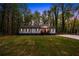 Charming home featuring a manicured lawn and beautiful landscaping at 2798 Hutchins Rd, Lawrenceville, GA 30044
