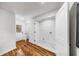 Bright laundry room featuring a white marble floor and matching white walls and a door leading outside at 2798 Hutchins Rd, Lawrenceville, GA 30044