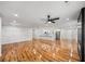 Spacious living room with hardwood floors, open to the kitchen, and featuring a modern fireplace at 2798 Hutchins Rd, Lawrenceville, GA 30044