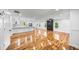 A spacious living room featuring a modern fireplace, hardwood floors, and an open layout connected to the kitchen at 2798 Hutchins Rd, Lawrenceville, GA 30044