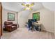 Bedroom features a large chair, computer desk and ceiling fan at 4150 Kalb Sw Ct, Smyrna, GA 30082