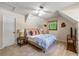 Bright bedroom features a sloped ceiling, ceiling fan and comfortable bed at 4150 Kalb Sw Ct, Smyrna, GA 30082