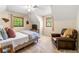 Cozy bedroom with sloped ceiling, a plush armchair, and natural light at 4150 Kalb Sw Ct, Smyrna, GA 30082