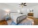 Bright bedroom boasts hardwood floors, ceiling fan and adjoins the bathroom at 4150 Kalb Sw Ct, Smyrna, GA 30082