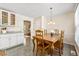 Dining area features a large table for six, modern light fixture, and neutral color palette at 4150 Kalb Sw Ct, Smyrna, GA 30082