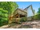 View of home exterior showing the multi-level deck and wooded surroundings at 4150 Kalb Sw Ct, Smyrna, GA 30082