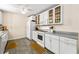 Bright kitchen with white cabinets, gray countertops, and modern appliances at 4150 Kalb Sw Ct, Smyrna, GA 30082