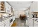 Clean kitchen with white cabinets, stainless steel appliances, and an adjacent dining area at 4150 Kalb Sw Ct, Smyrna, GA 30082