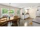 Open kitchen and dining area with ample counter space and a large window for natural light at 4150 Kalb Sw Ct, Smyrna, GA 30082