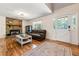 Cozy living room with a stone fireplace, hardwood floors, and a comfortable seating area at 4150 Kalb Sw Ct, Smyrna, GA 30082