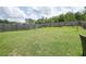 Large backyard features a swing set and playset, offering ample space for outdoor activities and Gathering fun at 5322 Burrus Sw Ln, Mableton, GA 30126