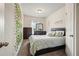 Bedroom features neutral colored walls, carpet, and closet at 5322 Burrus Sw Ln, Mableton, GA 30126