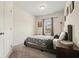 Cozy bedroom with carpet, neutral walls, and window that provides natural light for a relaxing atmosphere at 5322 Burrus Sw Ln, Mableton, GA 30126