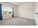 Bedroom with plush carpeting and a large window bringing in natural light, creating a serene space at 5322 Burrus Sw Ln, Mableton, GA 30126