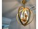 Stylish gold chandelier with a unique spherical design at 5322 Burrus Sw Ln, Mableton, GA 30126