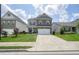 Beautiful home with brick and siding, a well-maintained lawn, and a two-car garage on a sunny day at 5322 Burrus Sw Ln, Mableton, GA 30126