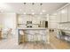 Open kitchen island with pendant lighting, stainless appliances and seating at 5322 Burrus Sw Ln, Mableton, GA 30126
