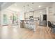 Spacious kitchen with stainless appliances, island seating and an adjacent dining area and a walkout to the backyard at 5322 Burrus Sw Ln, Mableton, GA 30126