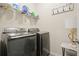 Laundry room boasts modern Samsung washer and dryer, providing convenience and style at 5322 Burrus Sw Ln, Mableton, GA 30126