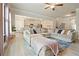 Open concept living room flowing into a kitchen with modern appliances and an expansive sectional sofa at 5322 Burrus Sw Ln, Mableton, GA 30126