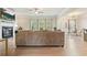 Open living room area boasts fireplace, large sofa and view into eat-in kitchen at 5322 Burrus Sw Ln, Mableton, GA 30126