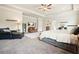 Spacious main bedroom features a seating area, television, and a carpeted floor at 5322 Burrus Sw Ln, Mableton, GA 30126
