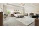 Spacious main bedroom with tray ceilings, ample natural light, and a cozy sitting area at 5322 Burrus Sw Ln, Mableton, GA 30126