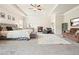 Spacious main bedroom featuring a tray ceiling, fireplace, sitting area and plush carpet at 5322 Burrus Sw Ln, Mableton, GA 30126