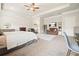 Spacious main bedroom featuring a tray ceiling, fireplace, sitting area and plush carpet at 5322 Burrus Sw Ln, Mableton, GA 30126