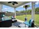 Covered patio with stylish outdoor furniture perfect for relaxation and entertaining with a ceiling fan and heater at 5322 Burrus Sw Ln, Mableton, GA 30126