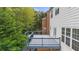 The wooden deck provides a peaceful setting with its natural backdrop, offering a relaxing outdoor living space at 2321 Norbury Se Cv, Smyrna, GA 30080