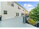 This home boasts a spacious back deck, ideal for entertaining, with steps leading to the landscaped backyard at 2321 Norbury Se Cv, Smyrna, GA 30080