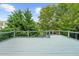 The spacious wooden deck provides a tranquil retreat surrounded by lush greenery and mature trees at 2321 Norbury Se Cv, Smyrna, GA 30080