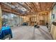 Unfinished basement with exposed ceiling, cement foundation, and wood framing at 2321 Norbury Se Cv, Smyrna, GA 30080