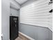 Basement featuring a modern security safe and white horizontal slat wall, providing safety and aesthetic appeal at 2321 Norbury Se Cv, Smyrna, GA 30080