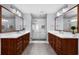 Bathroom features double vanities, hardwood cabinets, and a glass enclosed shower at 2321 Norbury Se Cv, Smyrna, GA 30080