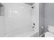 Clean bathroom with white subway tile surround tub, updated toilet, and modern fixtures providing comfort and convenience at 2321 Norbury Se Cv, Smyrna, GA 30080