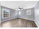 Bright bedroom features multiple windows, a ceiling fan, and hardwood floors at 2321 Norbury Se Cv, Smyrna, GA 30080