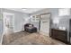 Bedroom featuring hardwood floors, a large floor-length mirror and chaise lounge for relaxation and style at 2321 Norbury Se Cv, Smyrna, GA 30080