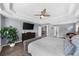 Bedroom boasting a tray ceiling, hardwood floors, and a large window for plenty of natural light at 2321 Norbury Se Cv, Smyrna, GA 30080