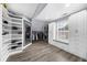 Large walk-in closet with custom shelving, cabinets, a window seat, and hardwood floors for ample storage at 2321 Norbury Se Cv, Smyrna, GA 30080