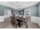 Dining area features elegant lighting, hardwood floors, and access to the kitchen at 2321 Norbury Se Cv, Smyrna, GA 30080
