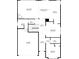 Detailed first floor plan showing living room, kitchen, laundry, garage, and bedroom dimensions at 2321 Norbury Se Cv, Smyrna, GA 30080