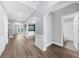 Open-concept foyer featuring hardwood floors, archways, and access to a bathroom at 2321 Norbury Se Cv, Smyrna, GA 30080