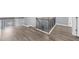 Hallway with hardwood floors and dark metal railings for a modern, stylish look at 2321 Norbury Se Cv, Smyrna, GA 30080