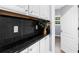 Kitchenette featuring granite countertops, white cabinets, and stainless steel hardware at 2321 Norbury Se Cv, Smyrna, GA 30080