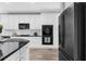 Modern kitchen boasts stainless steel appliances, a double oven and crisp, white cabinetry at 2321 Norbury Se Cv, Smyrna, GA 30080