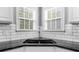 Modern kitchen sink with stainless steel faucet and a window with natural light at 2321 Norbury Se Cv, Smyrna, GA 30080