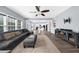 Open floor plan living room with hardwood floors, fireplace, and lots of natural light at 2321 Norbury Se Cv, Smyrna, GA 30080